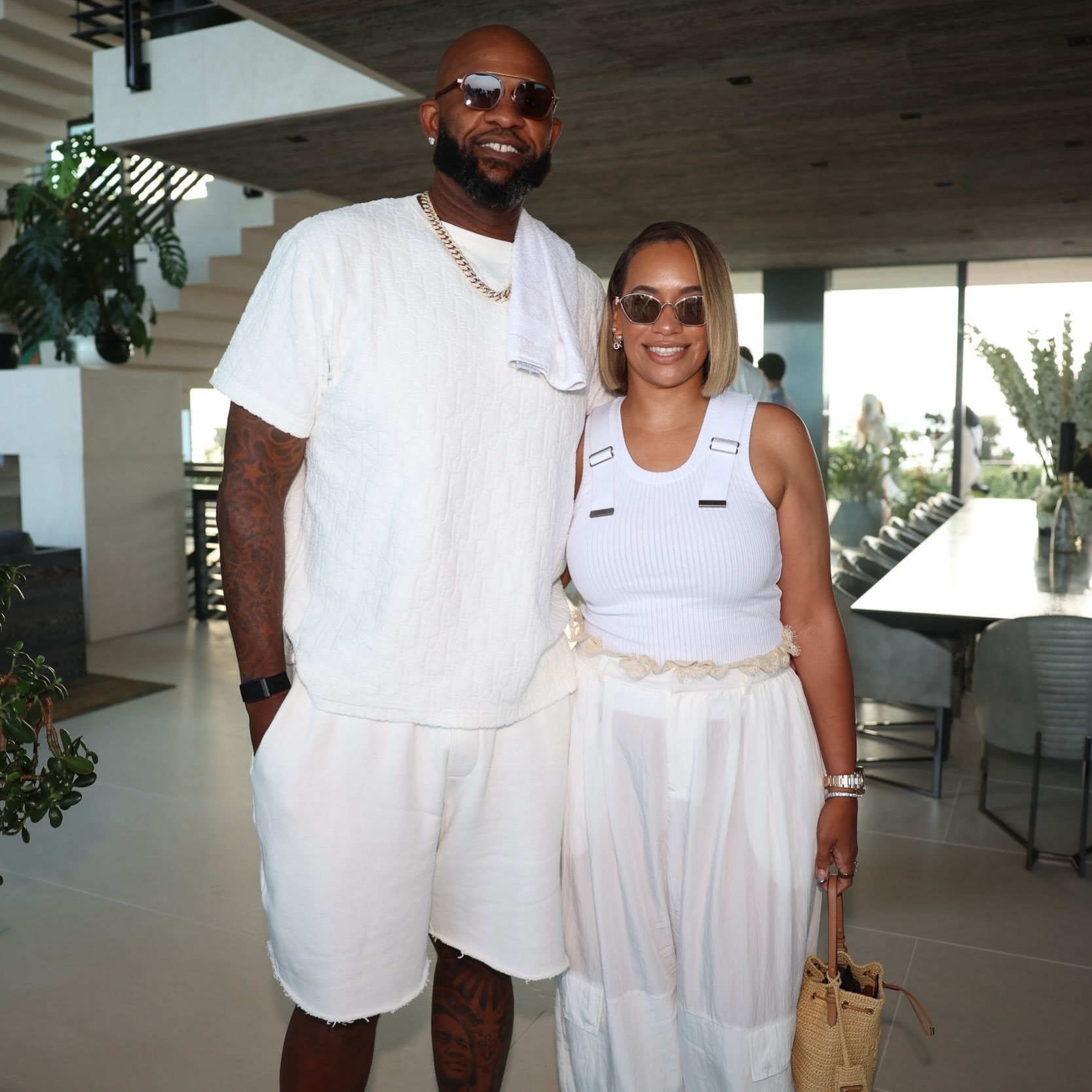 Couple dressed in white at an event, makeup by Rebecca Lee Artistry